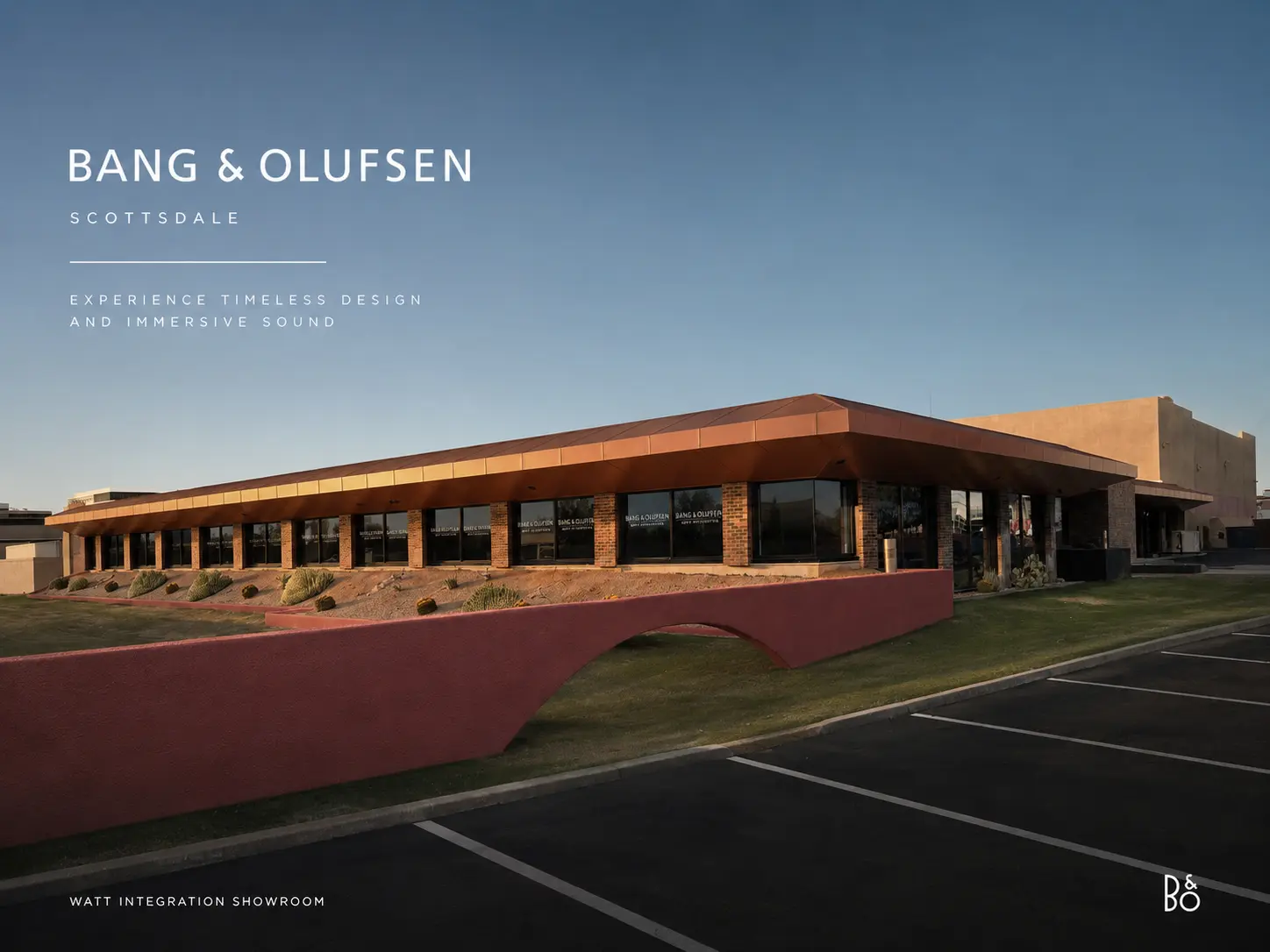 Bang & Olufsen Scottsdale brand card — the Watt Integration showroom exterior at dusk, copper canopy over the storefront glass