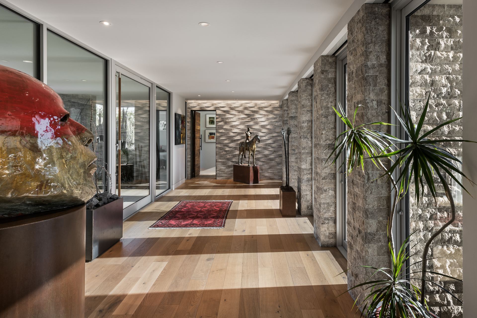 Gallery-style foyer of a Watt Integration project home with accent lighting