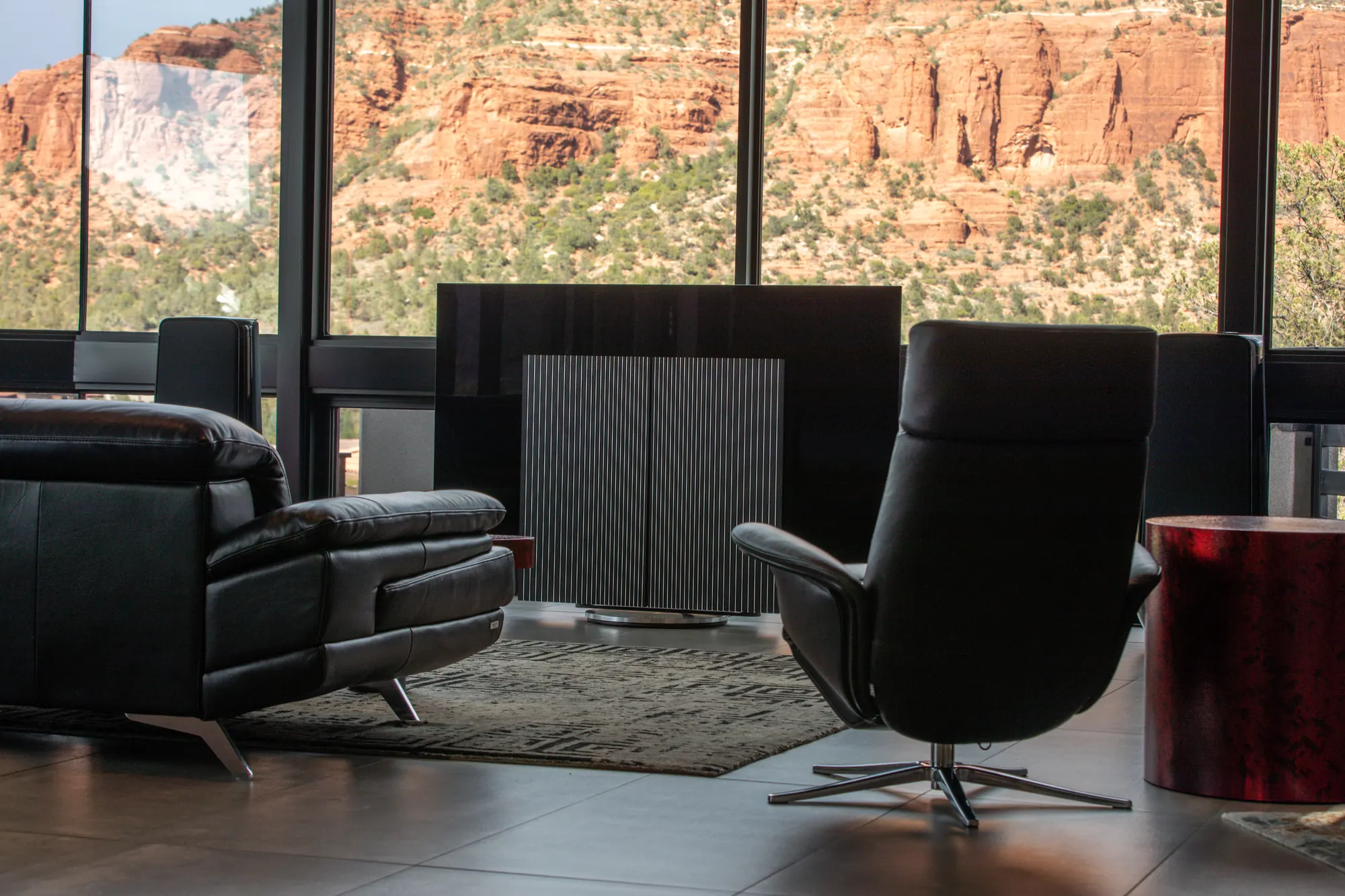 Bang & Olufsen Beovision Harmony with its oak speaker wings closed, red rock cliffs beyond the glass — from the Sedona listening-room project
