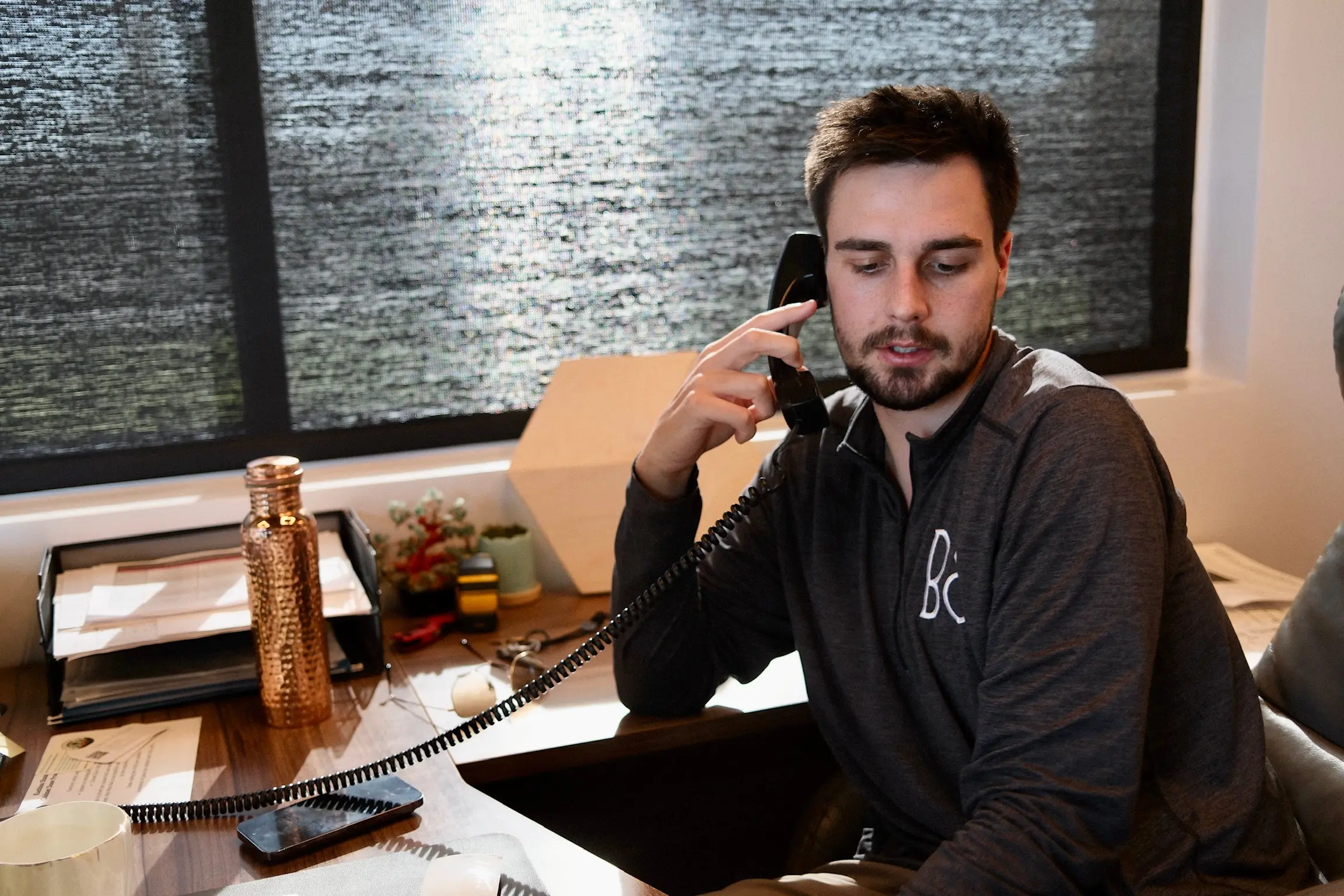 A Watt Integration support technician takes a member call at the desk